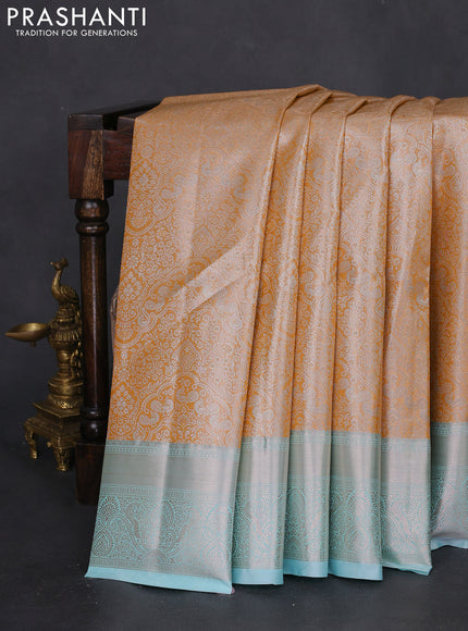 Bangalori tissue silk saree mustard yellow and teal blue with silver zari woven brocade weaves and zari woven border