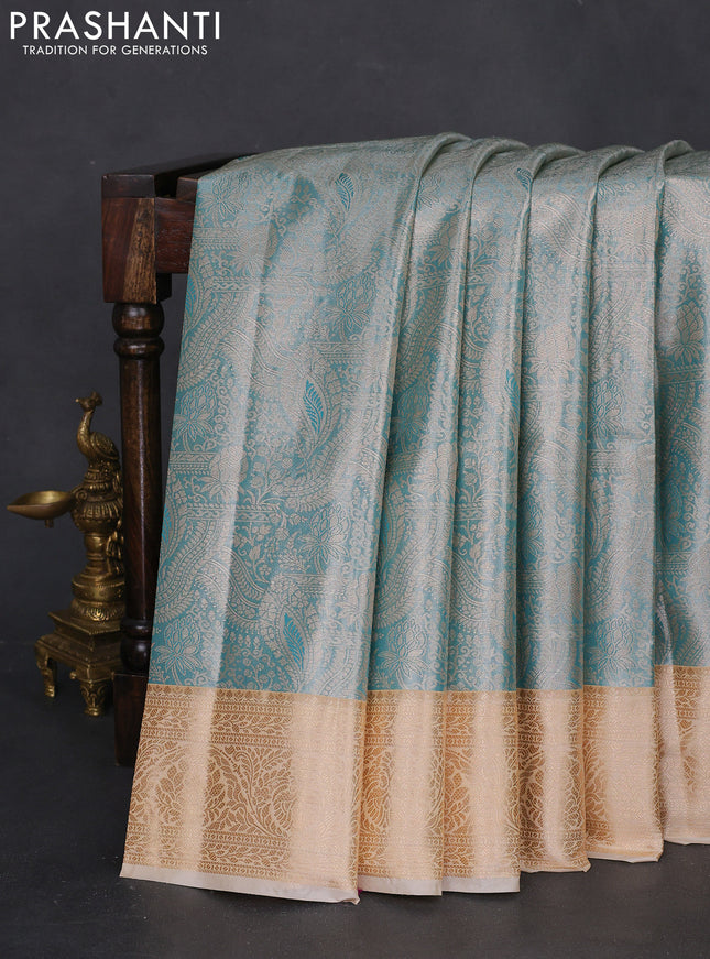 Bangalori tissue silk saree teal blue and cream with silver zari woven brocade weaves and zari woven border