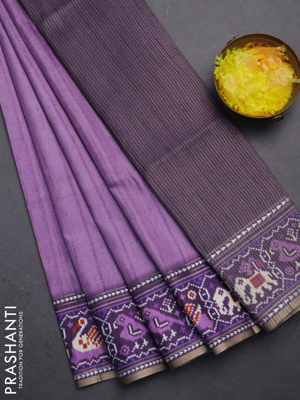 Semi tussar saree mild purple and purple with plain body and patola printed border