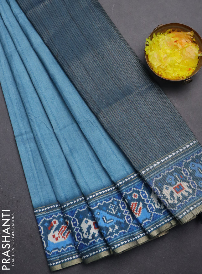 Semi tussar saree teal blue and peacock blue with plain body and patola printed border