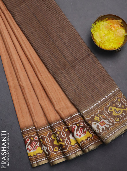 Semi tussar saree peach orange and brown with plain body and patola printed border