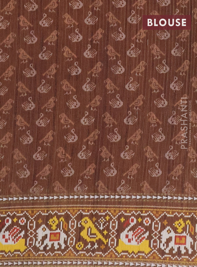 Semi tussar saree peach orange and brown with plain body and patola printed border
