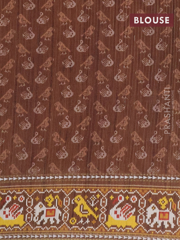 Semi tussar saree peach orange and brown with plain body and patola printed border