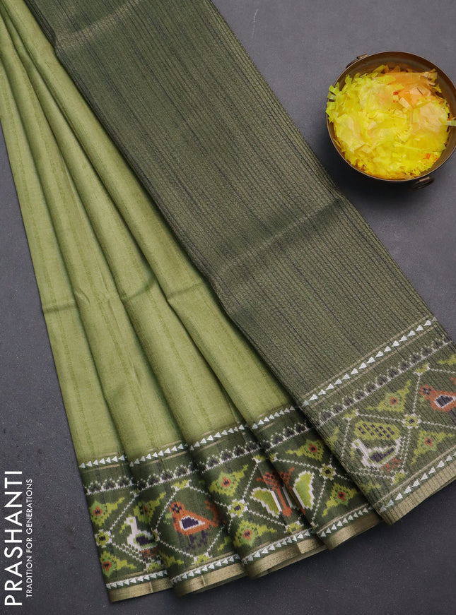 Semi tussar saree light green and sap green with plain body and patola printed border