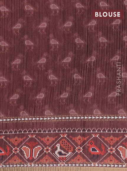 Semi tussar saree dark peach and brown with plain body and patola printed border