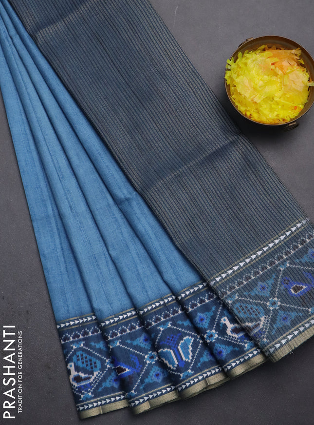 Semi tussar saree blue shade and peacock blue with plain body and patola printed border