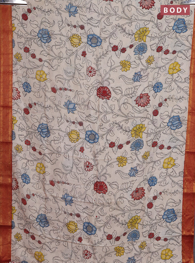 Kalamkari semi silk saree beige and rust shade with allover prints and zari woven border