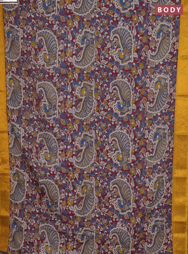 Kalamkari semi silk saree maroon and mustard yellow with allover prints and zari woven border