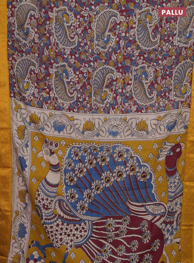 Kalamkari semi silk saree maroon and mustard yellow with allover prints and zari woven border