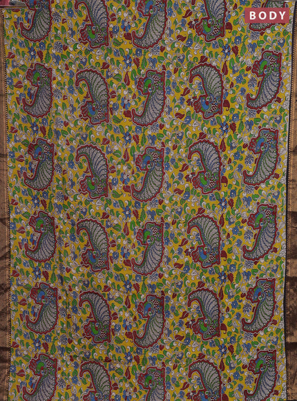 Kalamkari semi silk saree yellow and black with allover prints and zari woven border