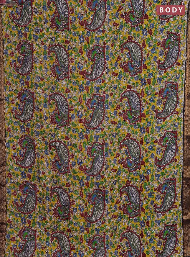 Kalamkari semi silk saree yellow and black with allover prints and zari woven border