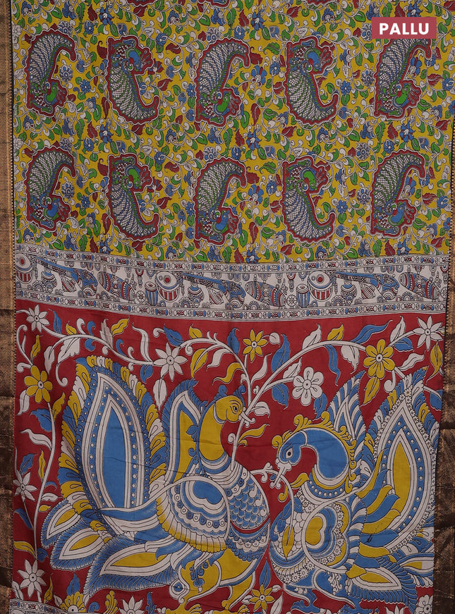 Kalamkari semi silk saree yellow and black with allover prints and zari woven border