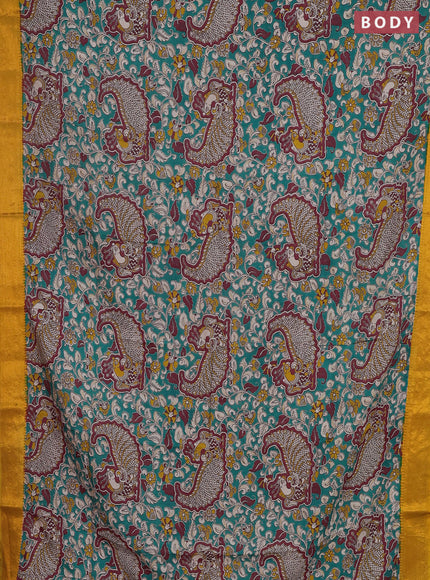 Kalamkari semi silk saree teal green and mustard yellow with allover prints and zari woven border