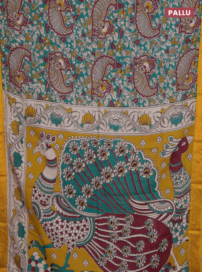 Kalamkari semi silk saree teal green and mustard yellow with allover prints and zari woven border