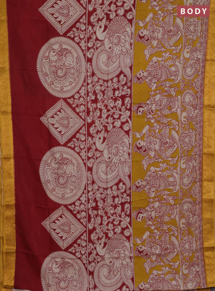 Kalamkari semi silk saree maroon and mustard yellow with allover prints and zari woven border