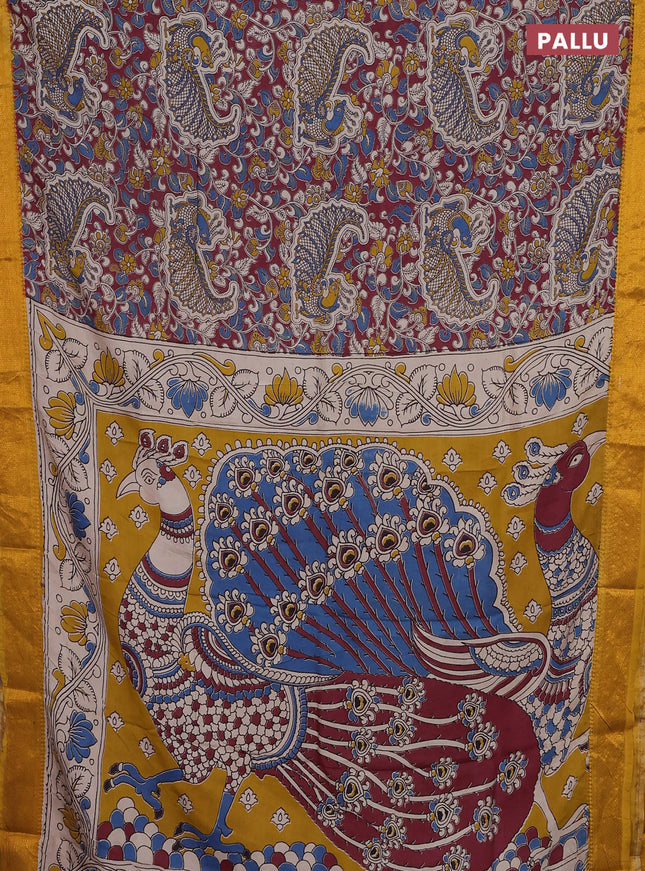 Kalamkari semi silk saree maroon and mustard yellow with allover prints and zari woven border
