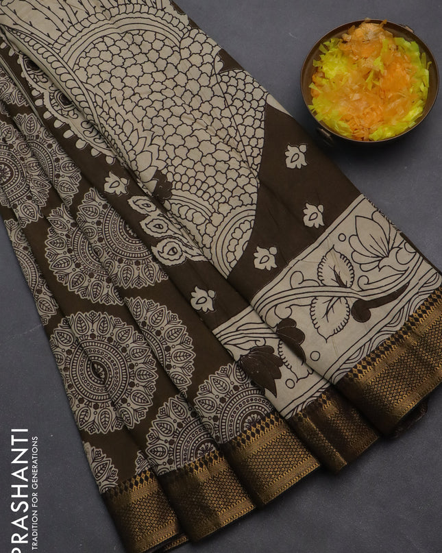 Kalamkari semi silk saree dark olive green and black with allover prints and zari woven border