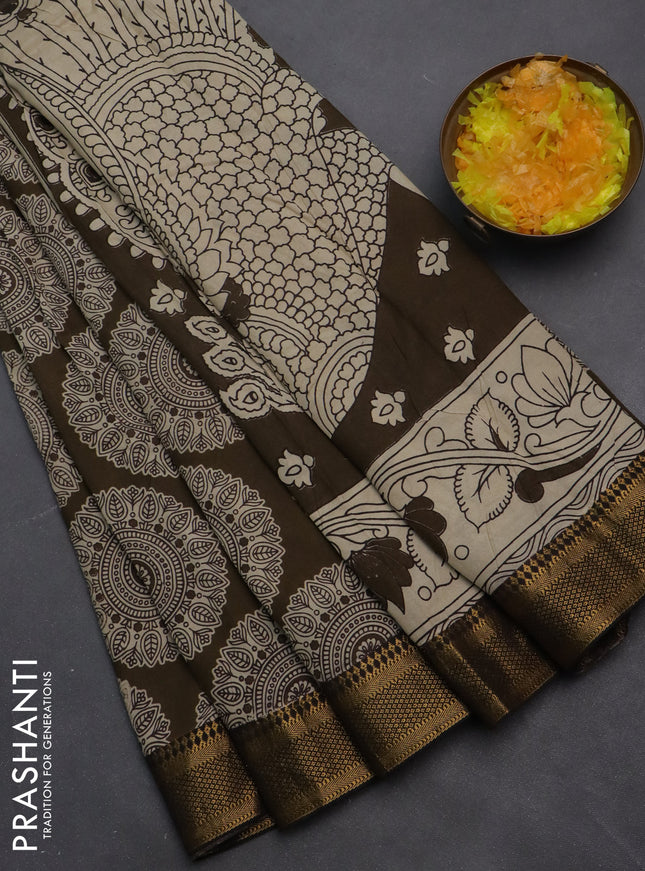 Kalamkari semi silk saree dark olive green and black with allover prints and zari woven border