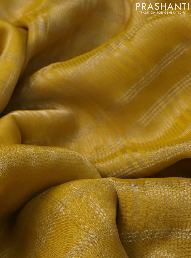 Tissue silk saree yellow and red with zari checked pattern & mirror work buttas