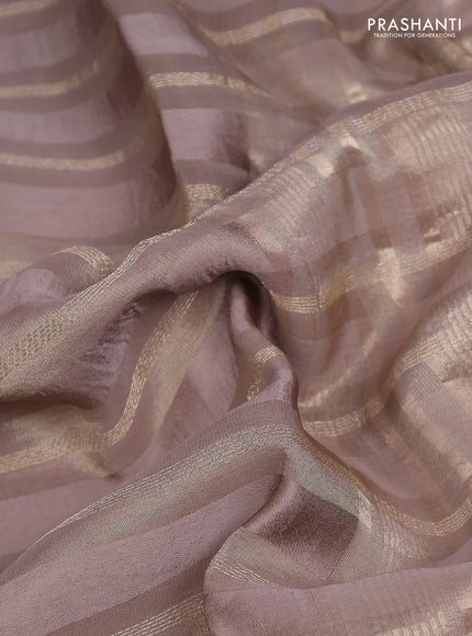 Tissue silk saree chikku shade with allover zari stripe pattern & zari border