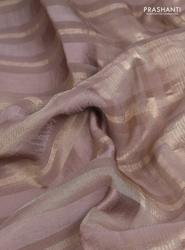 Tissue silk saree chikku shade with allover zari stripe pattern & zari border