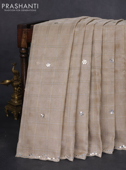 Tissue silk saree beige and black with zari checked pattern & mirror work buttas
