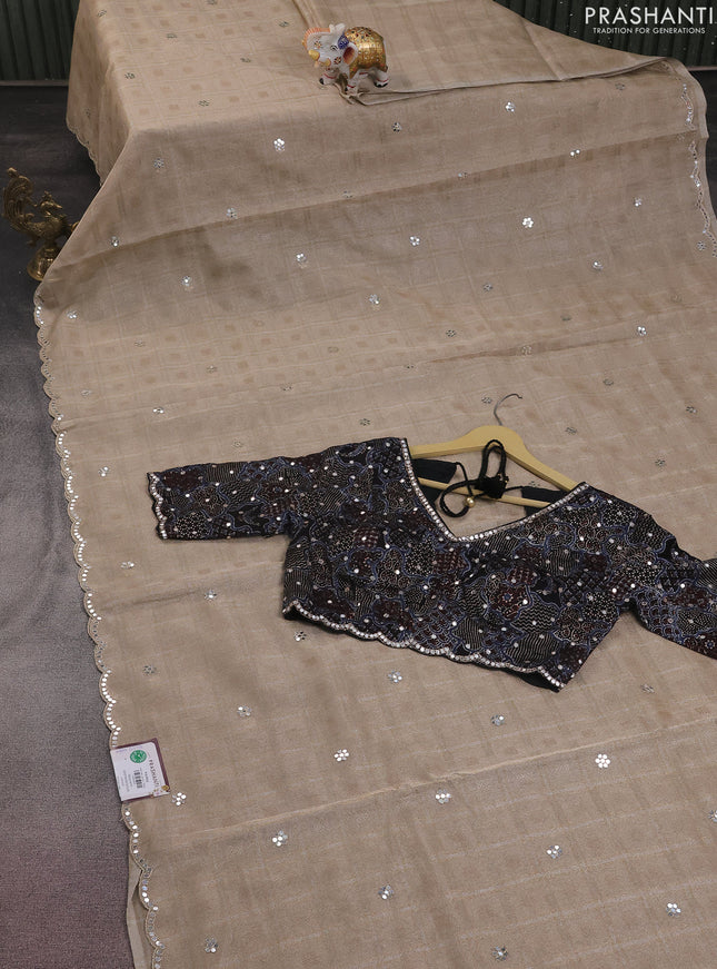 Tissue silk saree beige and black with zari checked pattern & mirror work buttas