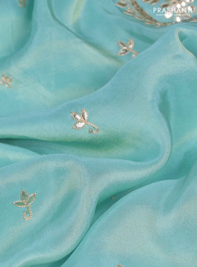 Tissue silk saree teal blue and navy blue with embridery buttas & gotapatti work pallu