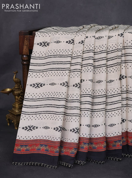 Crepe silk saree cream and black with patola prints & embroidery mirror work pallu