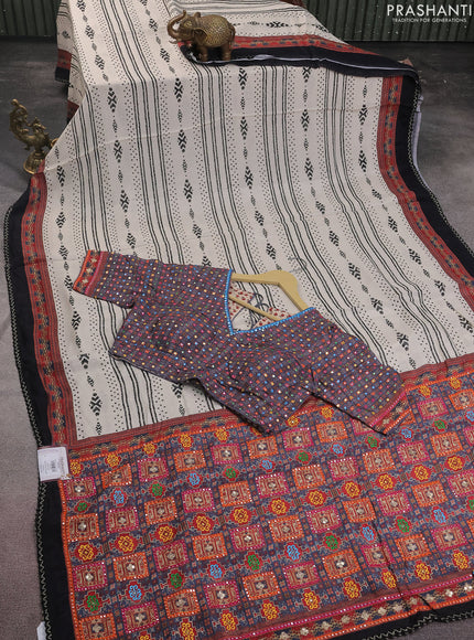 Crepe silk saree cream and black with patola prints & embroidery mirror work pallu