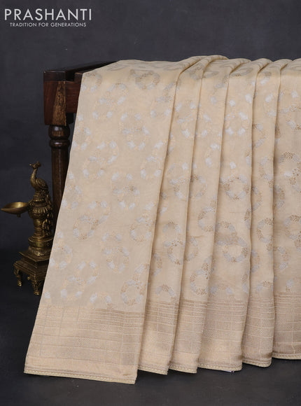 Banarasi silk saree cream with zari buttas & gotapatti work pallu
