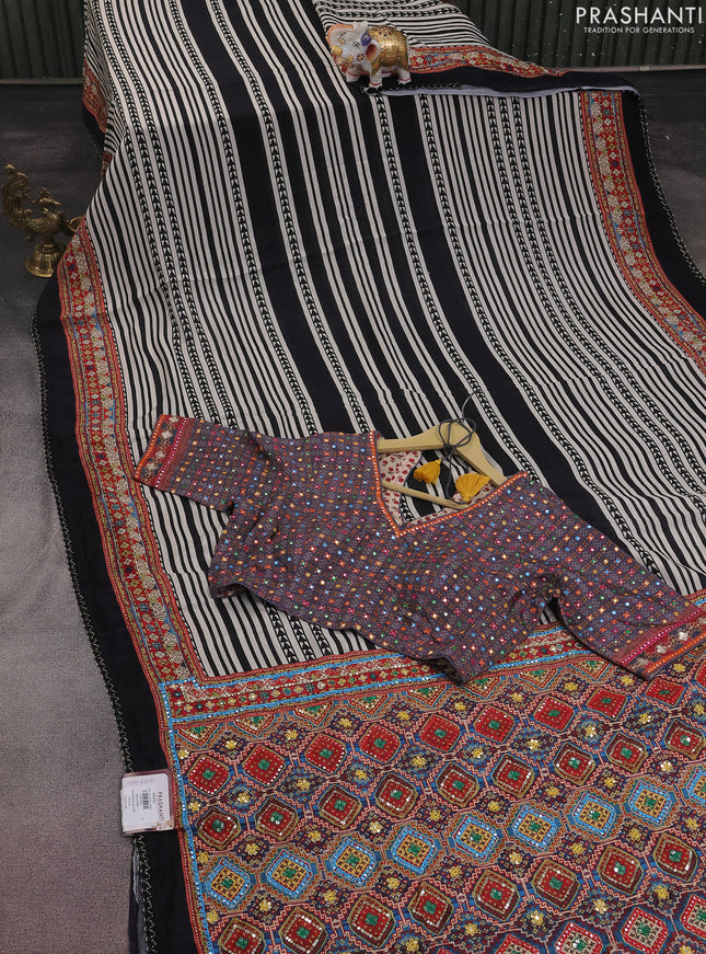 Crepe silk saree off white black and pastel violet with patola prints & embroidery mirror work pallu