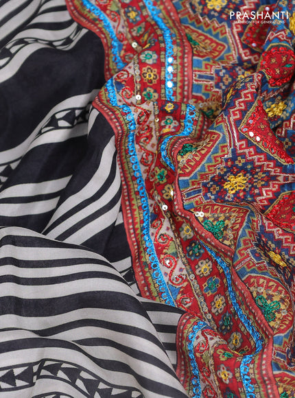 Crepe silk saree off white black and pastel violet with patola prints & embroidery mirror work pallu