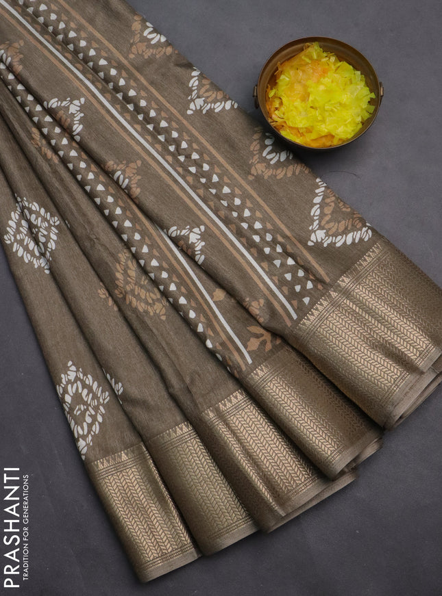 Semi dola saree grey shade with batik butta prints and zari woven border