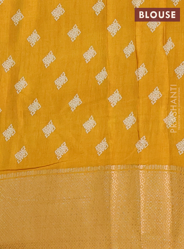 Semi dola saree mustard yellow with allover floral ikat prints and zari woven border