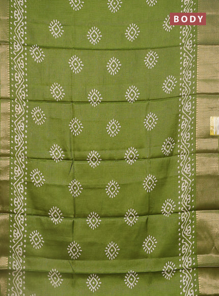 Semi dola saree light green with allover zari weaves & batik butta prints and zari woven border