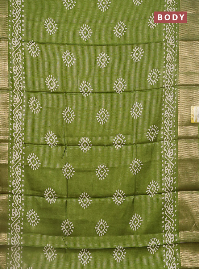 Semi dola saree light green with allover zari weaves & batik butta prints and zari woven border