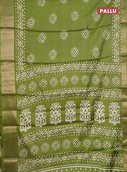 Semi dola saree light green with allover zari weaves & batik butta prints and zari woven border