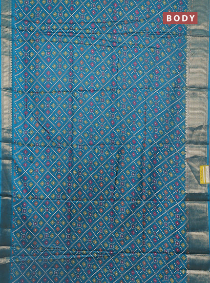 Semi dola saree teal green with allover bandhani prints and zari woven border