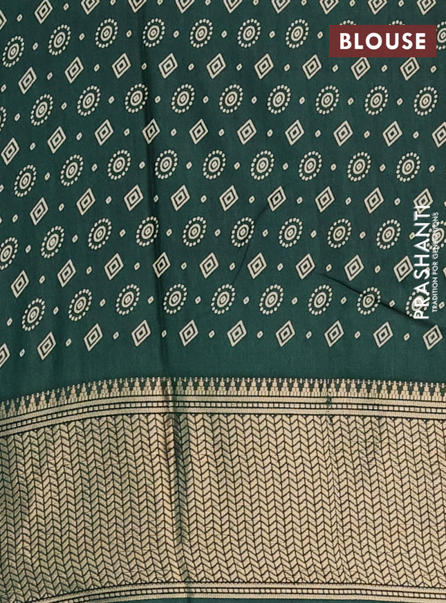 Semi dola saree dark green with allover bandhani prints and zari woven border