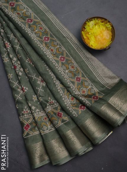 Semi dola saree green shade with allover prints and zari woven border