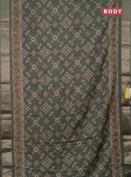 Semi dola saree green shade with allover prints and zari woven border