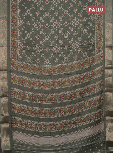 Semi dola saree green shade with allover prints and zari woven border