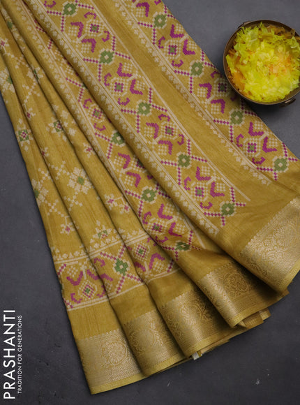Semi dola saree yellow shade with allover prints and zari woven border