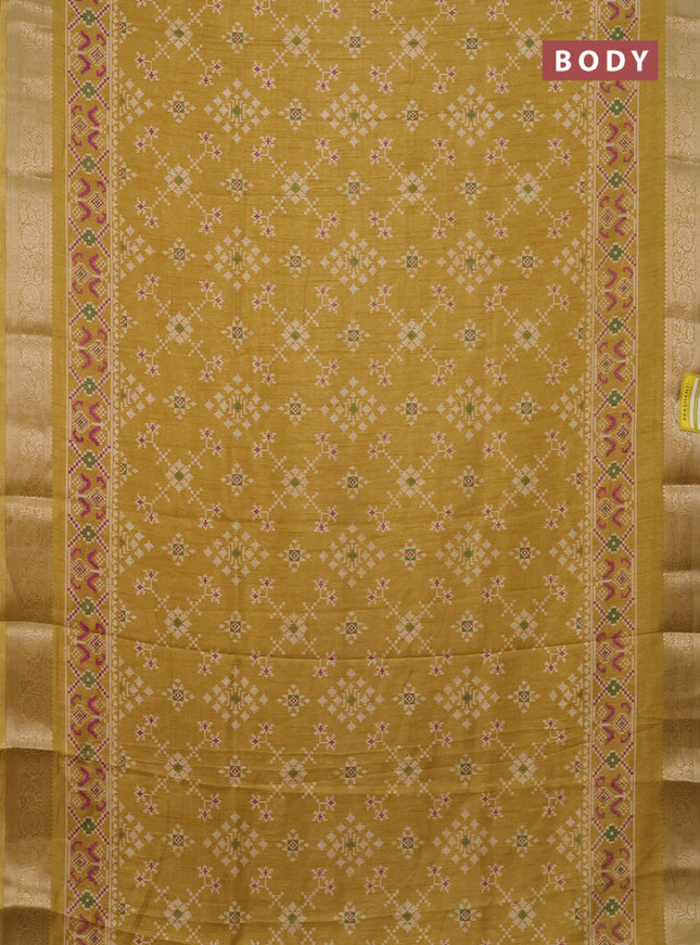 Semi dola saree yellow shade with allover prints and zari woven border