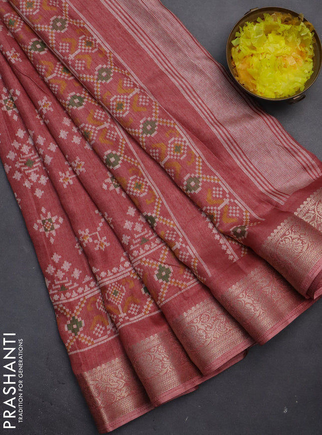 Semi dola saree rust shade with allover prints and zari woven border