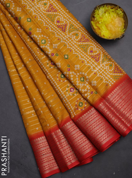 Semi dola saree mustard yellow and red with allover zari weaves & bandhani prints and zari woven border