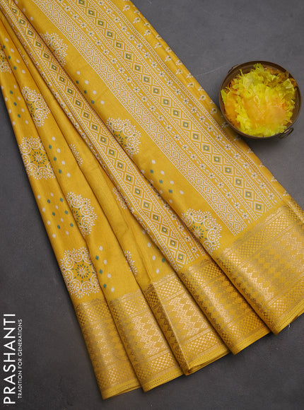 Semi dola saree yellow with allover butta prints and zari woven border