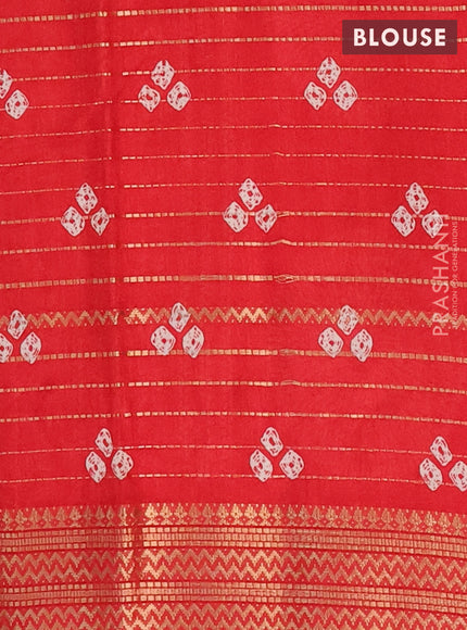 Semi dola saree red with allover zari weaves & bandhani prints and zari woven border