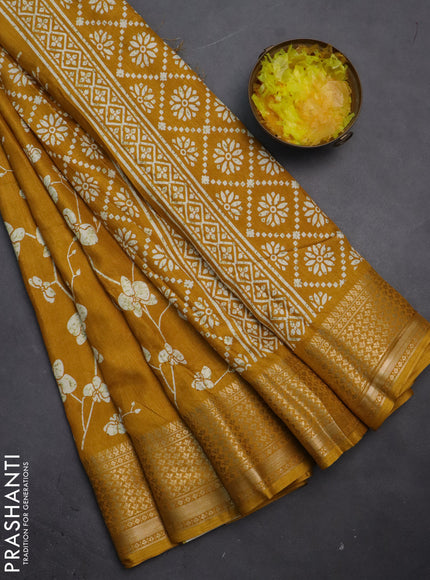 Semi dola saree mustard yellow with allover prints and zari woven border